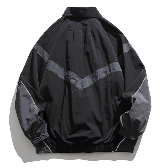 [Unisex] Oversize technische Wind- und Regenjacke mit Stehkragen, reflektierenden Paspeln und elastischem Saum Nord Taschen