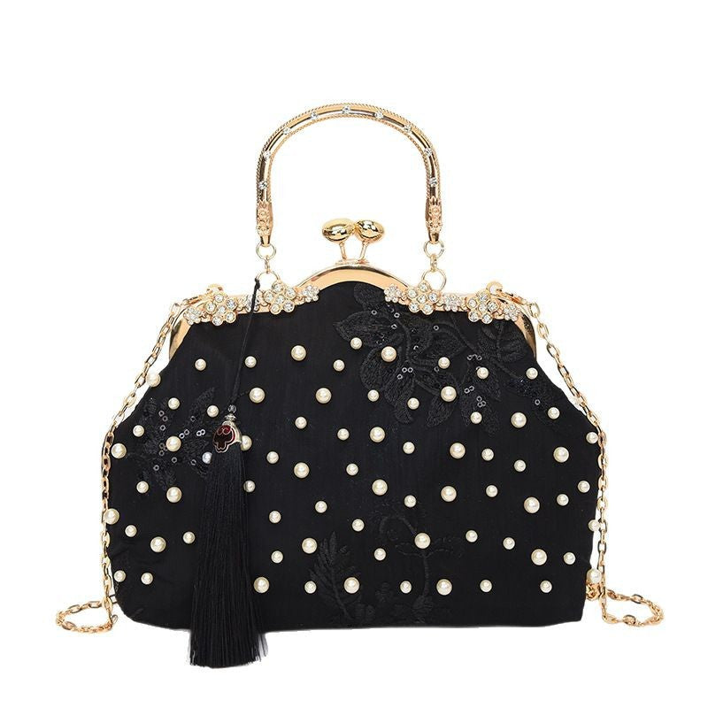 Damen elegante Handtasche mit perlenverziertem Design und Metallakzenten Nord Taschen