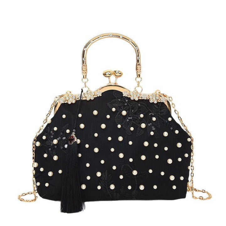 Damen elegante Handtasche mit perlenverziertem Design und Metallakzenten Nord Taschen