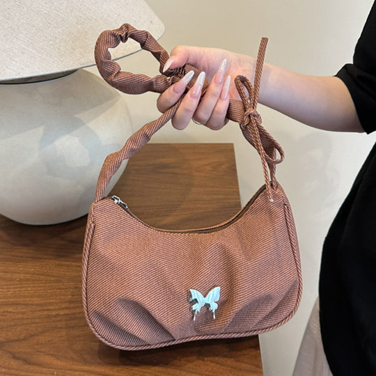 Damen Handtasche mit kreativer Faltentechnik und verspieltem Trageriemen Nord Taschen