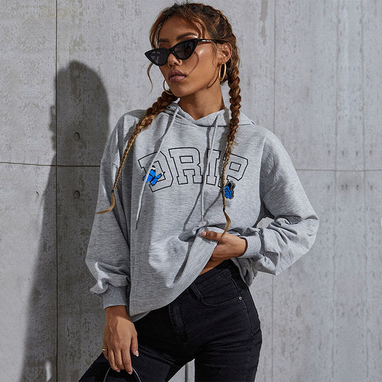 Damen Oversize-Kapuzenpullover mit Kängurutasche und Schmetterling-Stickerei Nord Taschen