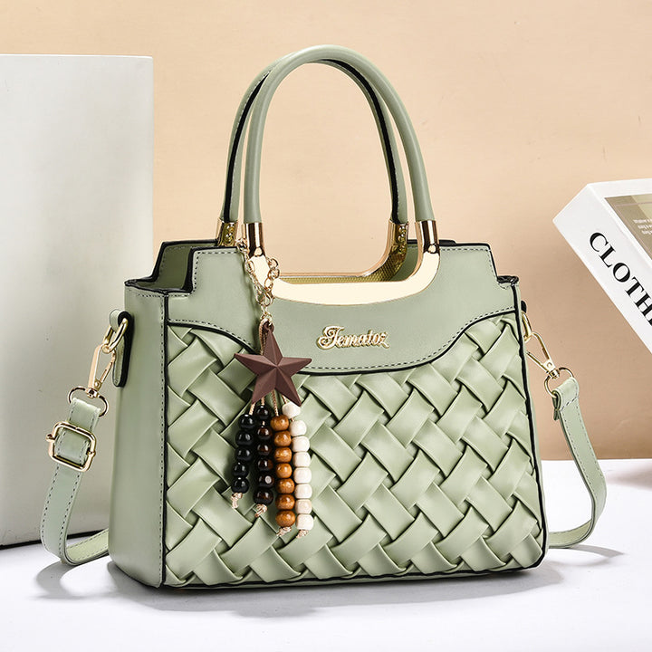 Damen elegante Handtasche mit kunstvollem Flechtmuster und abnehmbarer Quaste Nord Taschen