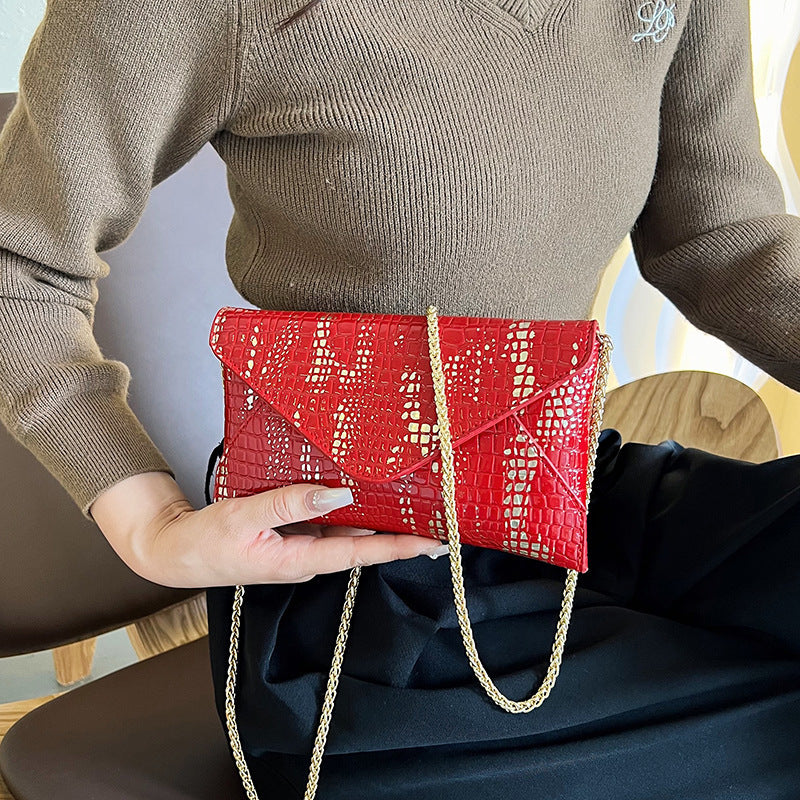 Damen Glamouröse Clutch-Tasche mit Kroko-Prägung und goldenen Akzenten Nord Taschen