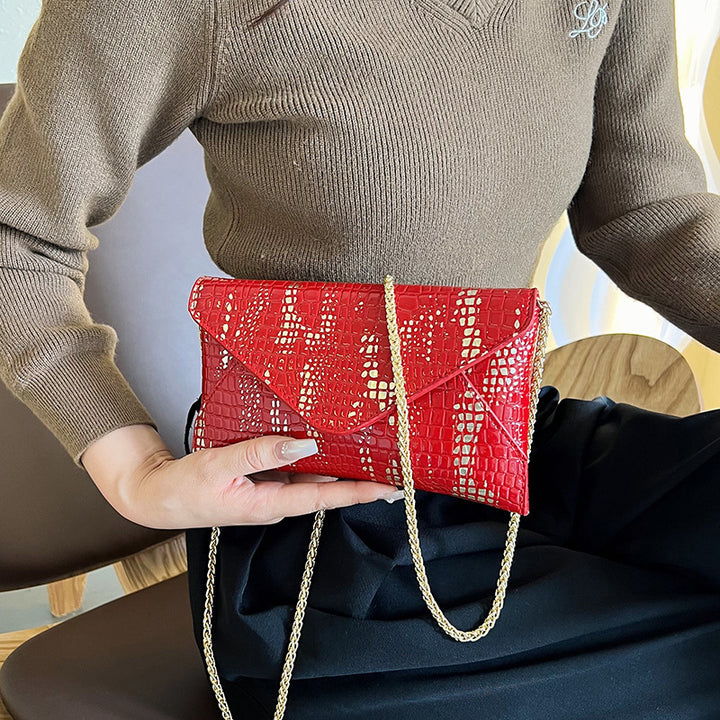 Damen Glamouröse Clutch-Tasche mit Kroko-Prägung und goldenen Akzenten Nord Taschen