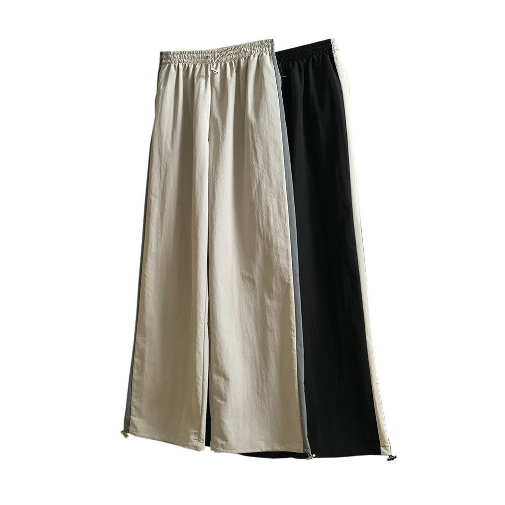 Damen Weite High‑Waist Trackhose im Palazzoschnitt mit kontrastierendem Seitenstreifen Nord Taschen