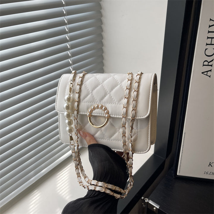 Damen elegante Handtasche mit strukturiertem Design und femininen Perlenakzenten Nord Taschen