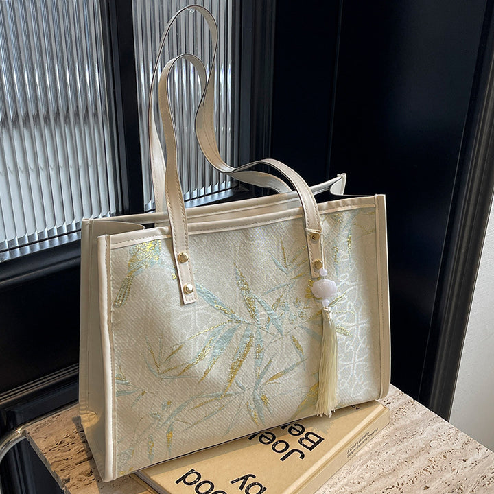 Damen Tragetasche mit floralem Stickdesign und elegantem Quastenanhänger Nord Taschen