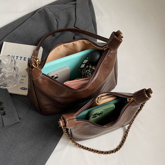 Damen stylische Umhängetasche mit goldenen Kettendetails Nord Taschen