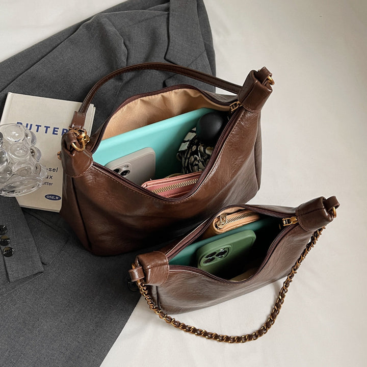 Damen stylische Umhängetasche mit goldenen Kettendetails Nord Taschen