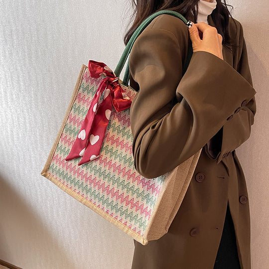Damen Jute-Shopper mit modernem Wellenmuster und dekorativem Schleifenakzent Nord Taschen