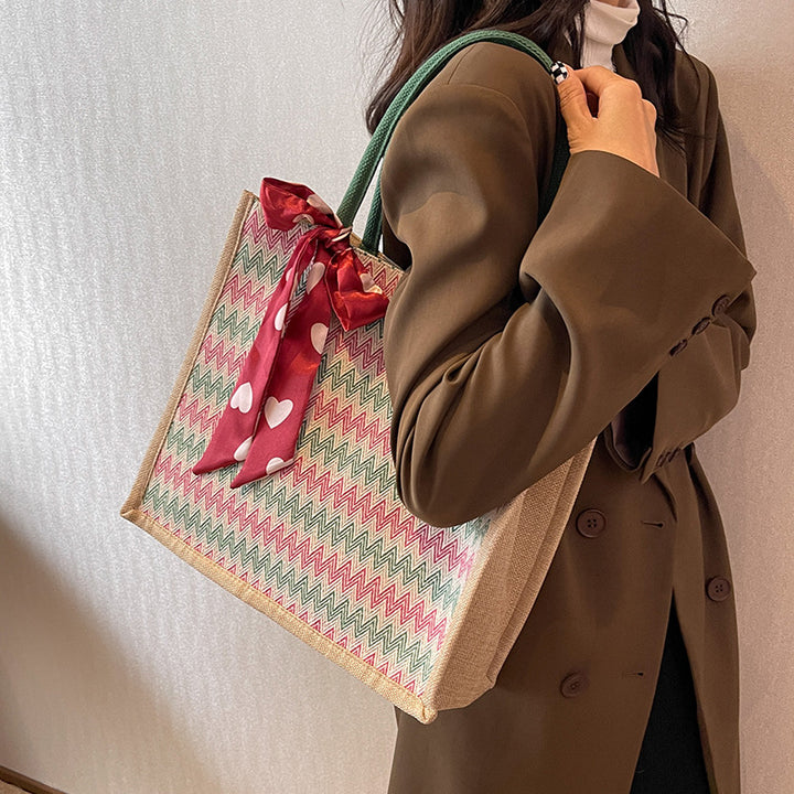 Damen Jute-Shopper mit modernem Wellenmuster und dekorativem Schleifenakzent Nord Taschen