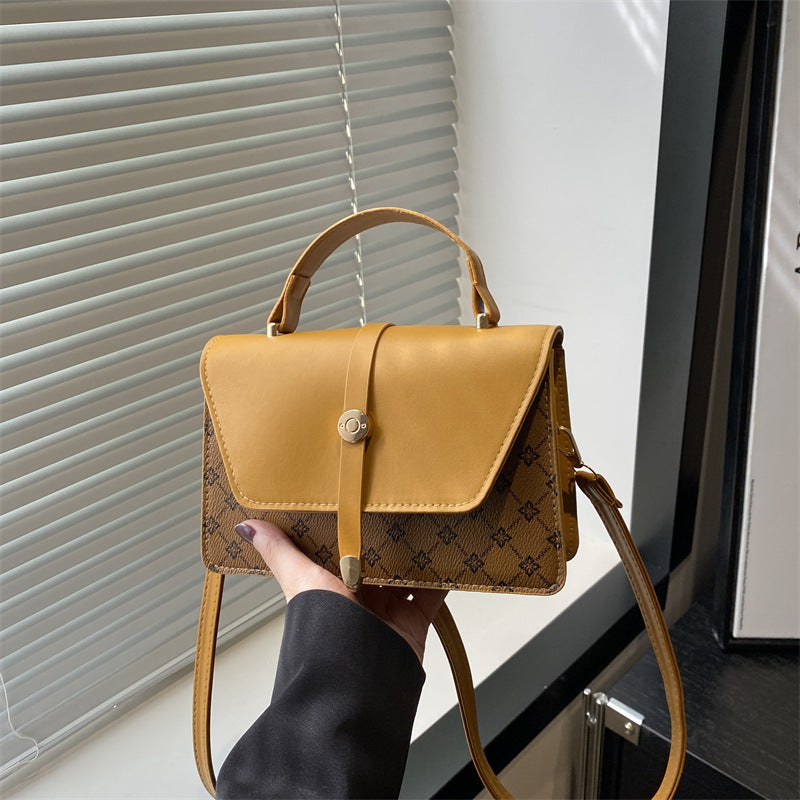 Damen Umhängetasche mit modernem Klappenverschluss und praktischem Handgriff Nord Taschen