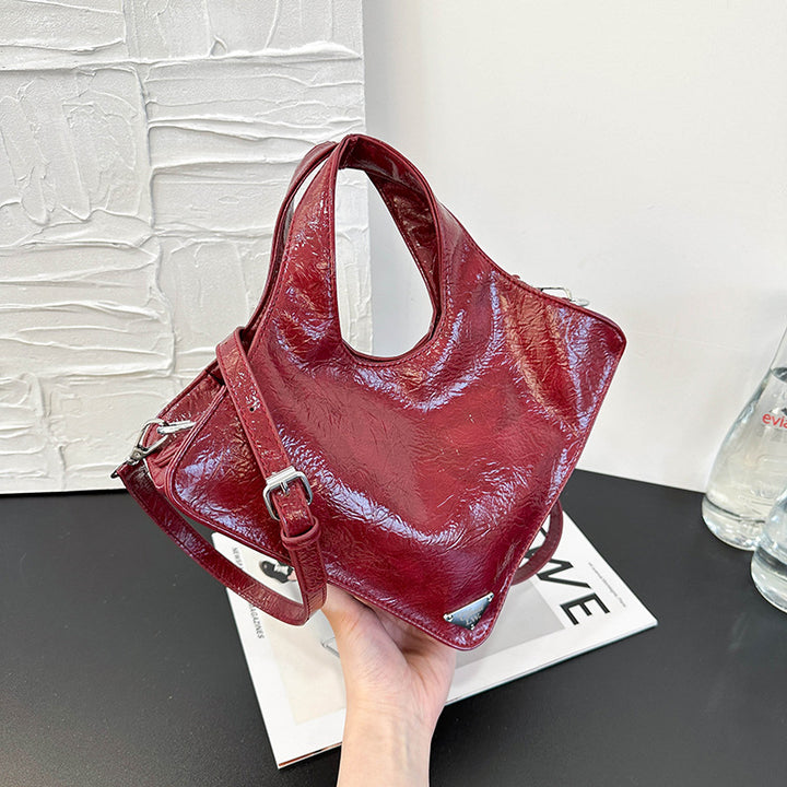 Damen stilvolle Handtasche aus glänzendem Kunstleder Nord Taschen