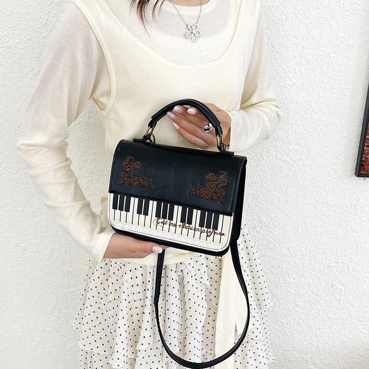 Damen Handtasche mit Klaviermotiv Nord Taschen