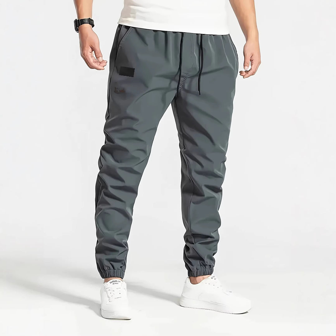 Herren Technische Jogginghose im Tapered‑Utility‑Stil mit elastischem Bund & Knöchelbündchen Nord Taschen