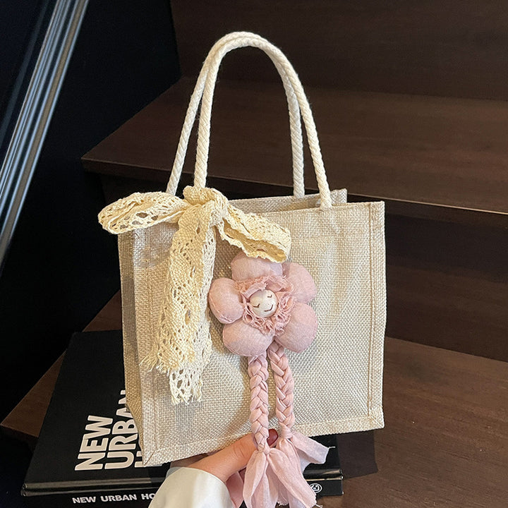 Damen Handtasche mit floralen Details und romantischem Bogen Nord Taschen