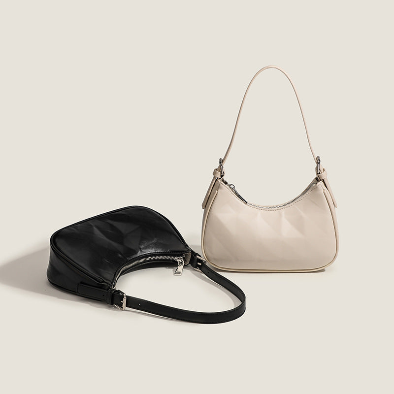 Damen Umhängetasche mit glänzender Oberflächenstruktur und einzigartigem Design Nord Taschen