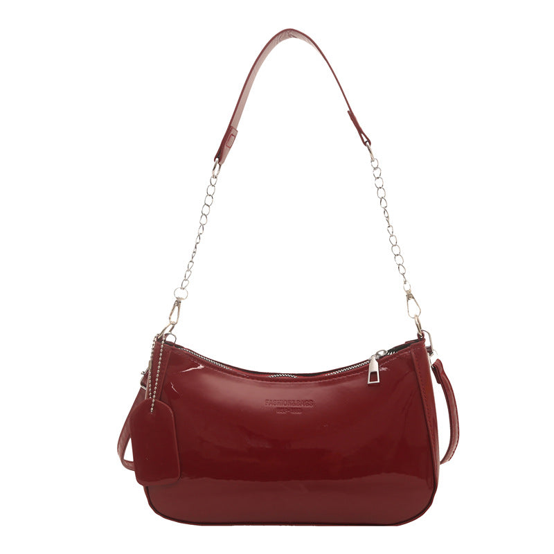 Damen elegante Umhängetasche mit glänzender Lackoberfläche Nord Taschen