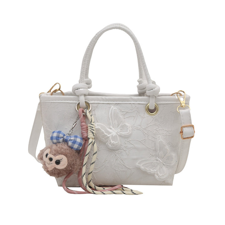 Damen elegante Umhängetasche mit floralem Design und charmantem Anhänger Nord Taschen