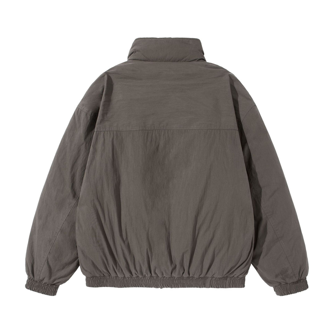 Unisex Kurz geschnittene gesteppte Boxy‑Blousonjacke mit hohem Stehkragen und Utility‑Flaptaschen Nord Taschen