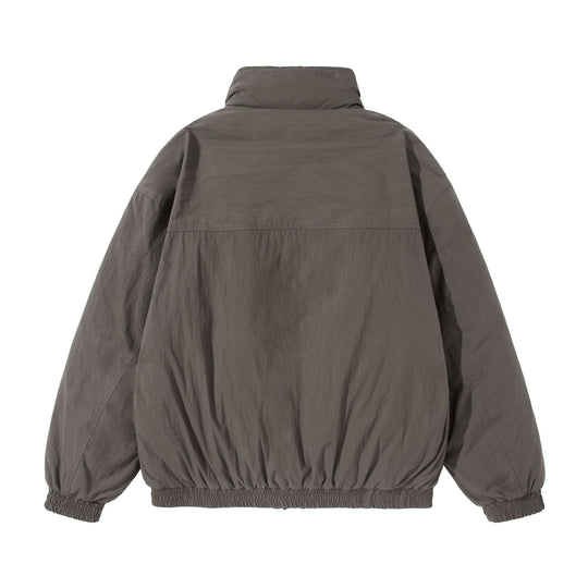 Unisex Kurz geschnittene gesteppte Boxy‑Blousonjacke mit hohem Stehkragen und Utility‑Flaptaschen Nord Taschen