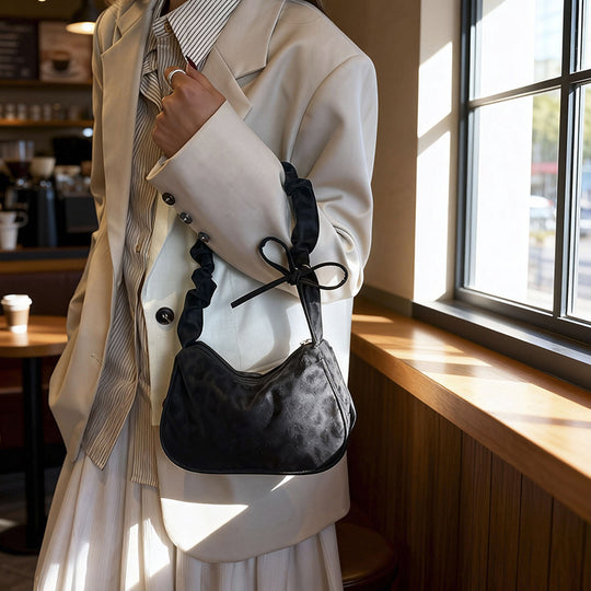 Damen Umhängetasche mit strukturiertem Design und stilvollem Kordelzug Nord Taschen