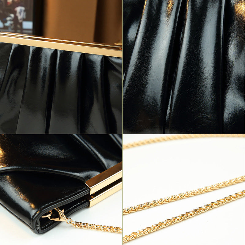 Damen Clutch mit luxuriösem Faltendesign und schimmernder Oberfläche Nord Taschen