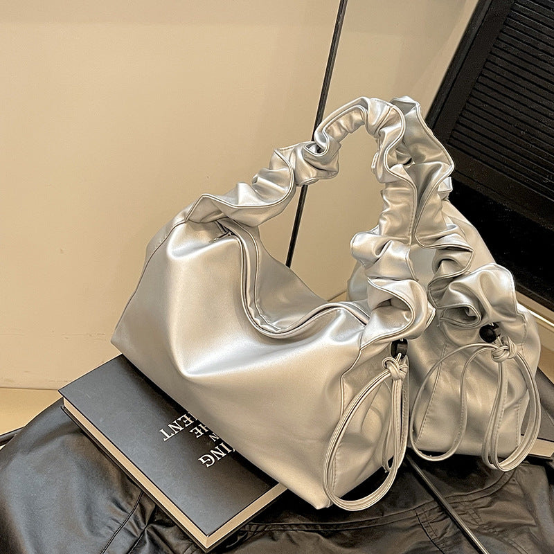 Damenhandtasche mit strukturiertem Polsterdesign und elegantem Tragegriff Nord Taschen