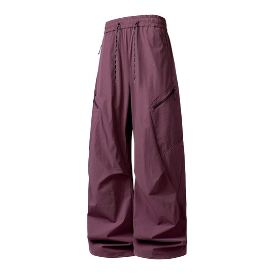 Herren Oversize-Utility-Cargo-Hose aus leichtem Nylon mit elastischem Kordbund, seitlichen Reißverschlusstaschen & weiter Ballon-Silhouette Nord Taschen