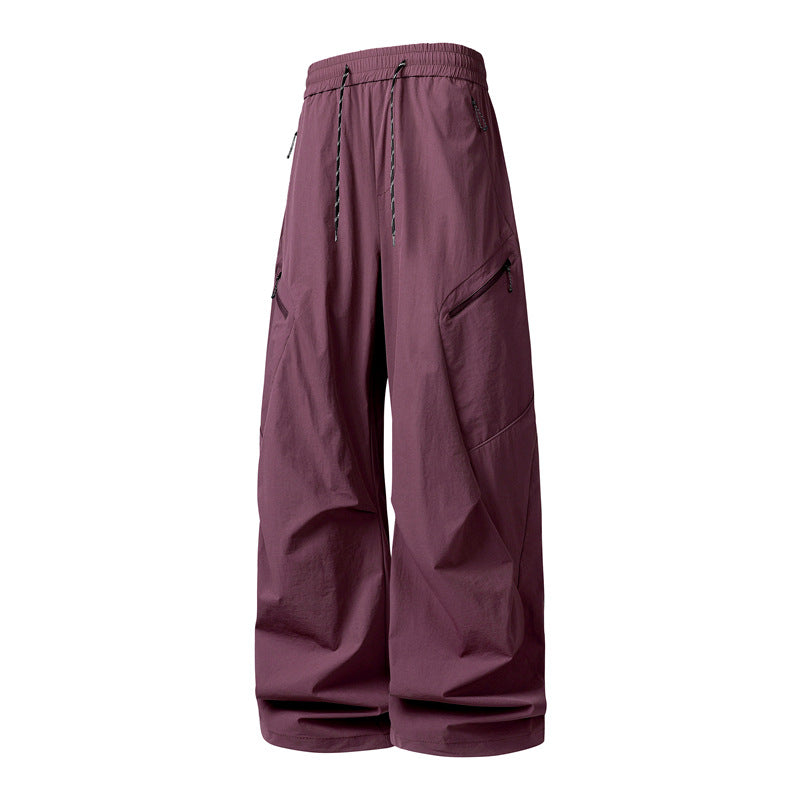 Herren Oversize-Utility-Cargo-Hose aus leichtem Nylon mit elastischem Kordbund, seitlichen Reißverschlusstaschen & weiter Ballon-Silhouette Nord Taschen