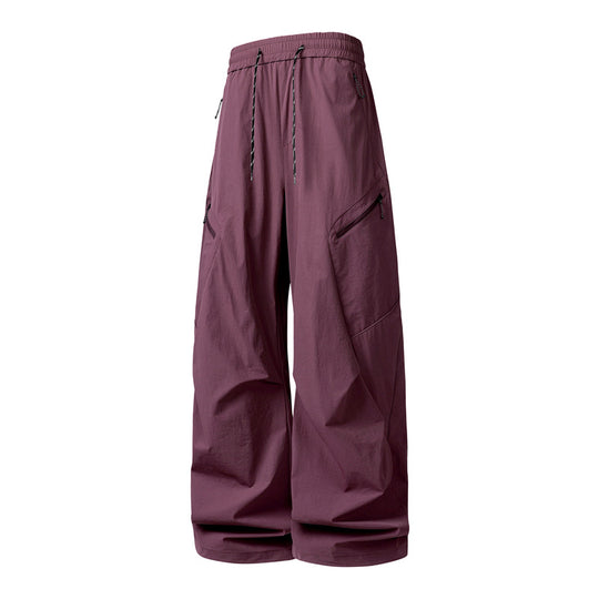 Herren Oversize-Utility-Cargo-Hose aus leichtem Nylon mit elastischem Kordbund, seitlichen Reißverschlusstaschen & weiter Ballon-Silhouette Nord Taschen