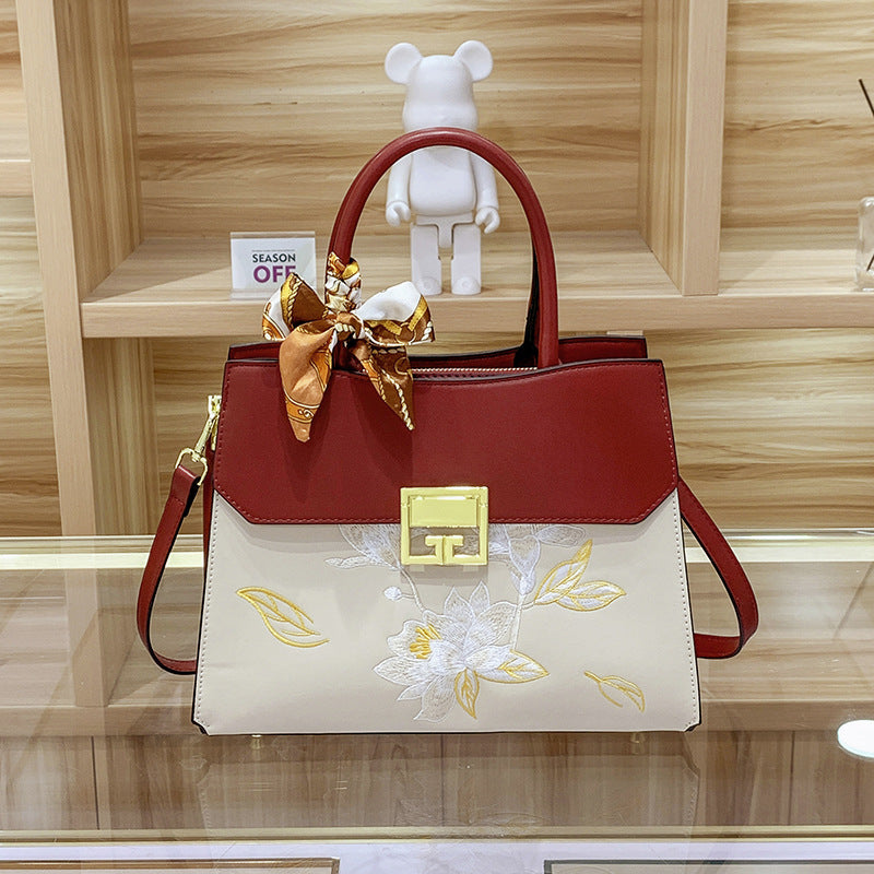 Damen Handtasche mit elegantem floralem Design und praktischen Trageoptionen Nord Taschen