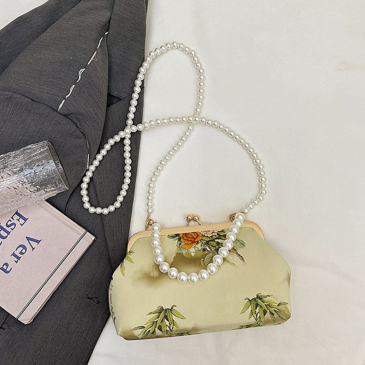 Damen elegante Handtasche mit zartem Blumendruck und Perlenkette Nord Taschen