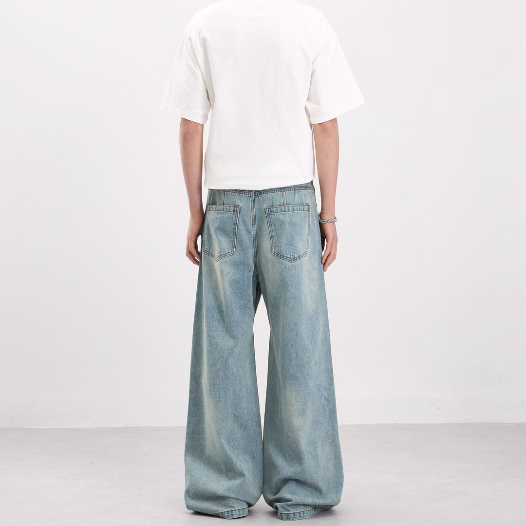 Herren Weit geschnittene Denim-Palazzohose mit geschwungenen Nahtpaneelen und extralangem Saum Nord Taschen