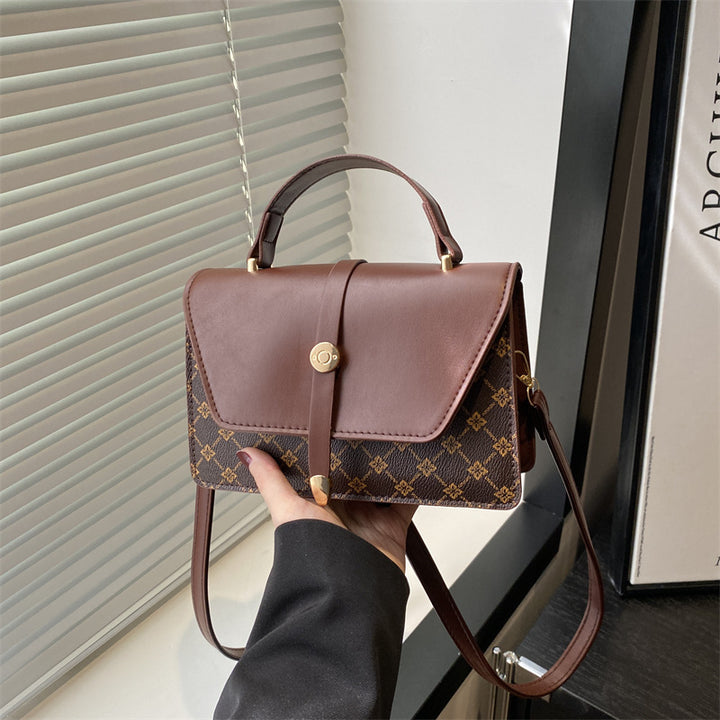 Damen Umhängetasche mit modernem Klappenverschluss und praktischem Handgriff Nord Taschen
