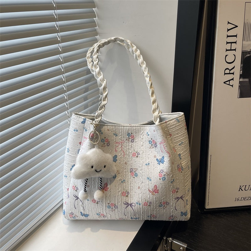 Damen modische Handtasche mit blumigem Design und verspieltem Anhänger Nord Taschen