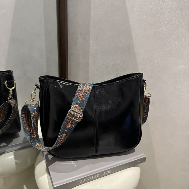 Damen Umhängetasche mit auffälligem dekorativem Trageriemen Nord Taschen