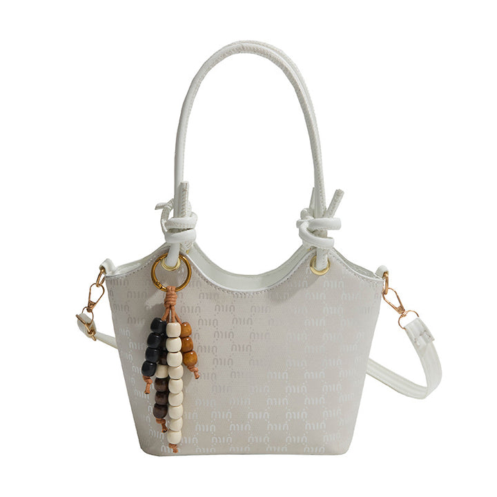 Damen Mini-Handtasche mit schimmerndem Obermaterial und eleganten Accessoires Nord Taschen