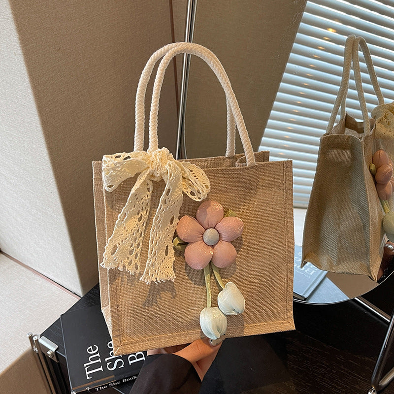 Damen Jute-Handtasche mit floralen Applikationen und dekorativem Schleifen-Design Nord Taschen