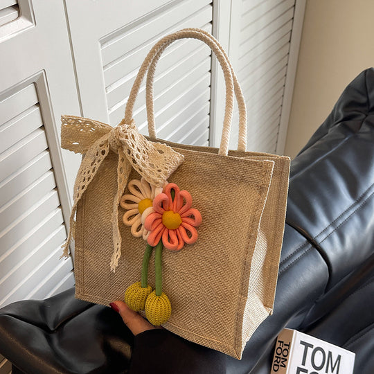 Damen Jute-Tasche mit dekorativer Blumenapplikation und verspieltem Schleifenverschluss Nord Taschen