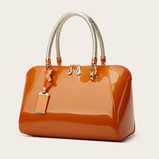 Damen Handtasche mit eleganter Lackoberfläche und geflochtenen Griffen Nord Taschen