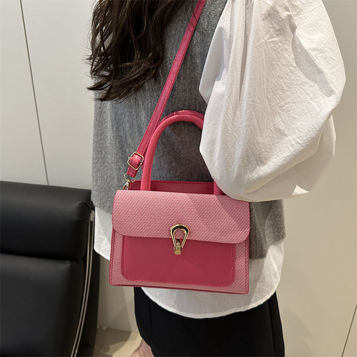 Damen elegante Umhängetasche mit strukturiertem Obermaterial und goldfarbener Verschlussmechanik Nord Taschen