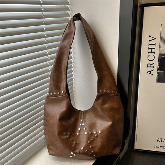 Damen Hobo-Tasche mit eleganter Sternenverzierung und strukturiertem Kunstleder Nord Taschen