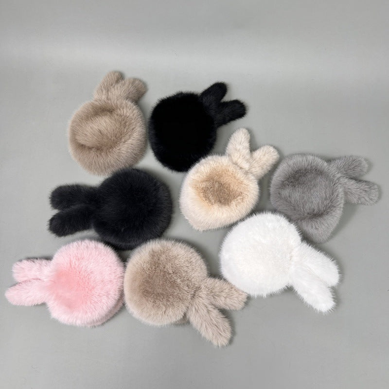 Damen Plüsch-Kunstpelz-Mütze im Trapperstil mit Ohrklappen und dekorativem Schwanz Nord Taschen