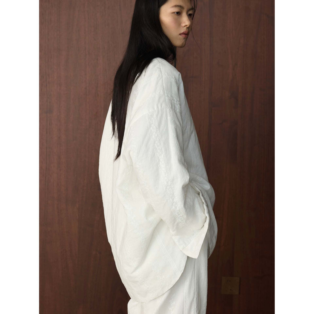Damen Oversized strukturierte Longbluse mit Rundhals und verlängertem Saum Nord Taschen