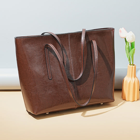 Damen Elegante Leder-Totetasche mit seitlichem Reißverschluss und geräumigem Innenraum Nord Taschen