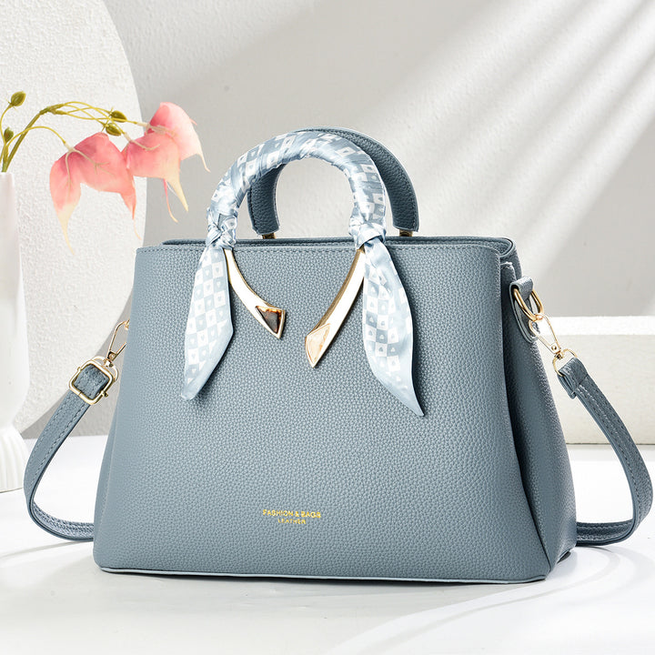 Damen elegante Handtasche mit dekorativer Schal-Applikation Nord Taschen