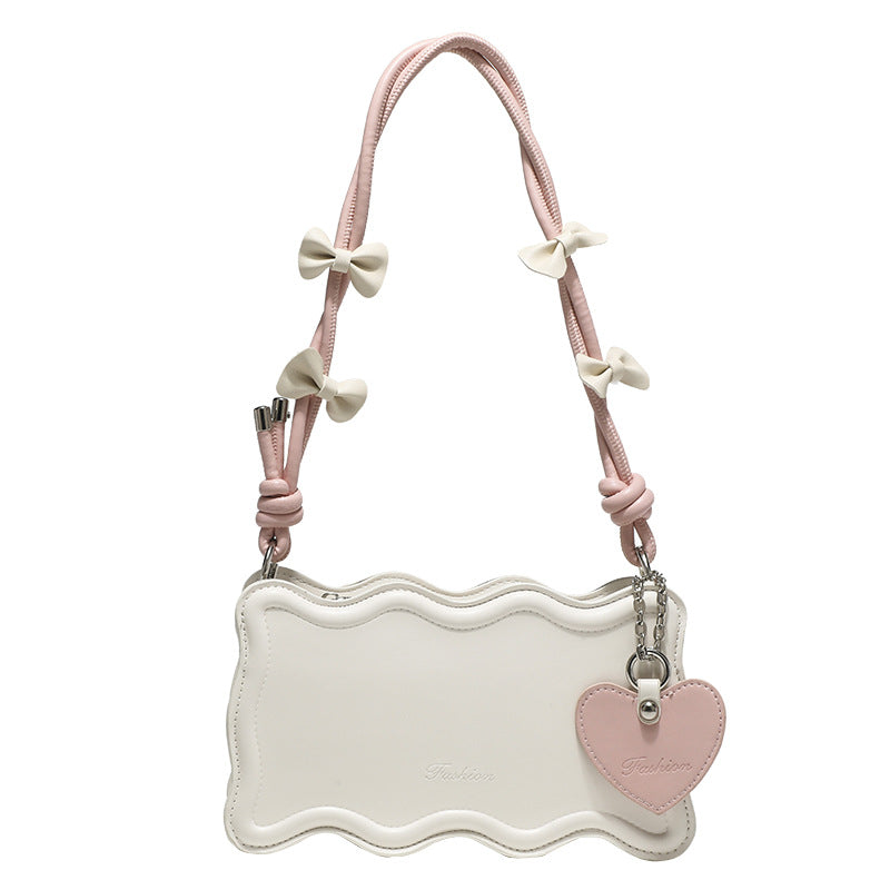 Damen Mini-Handtasche mit kreativem Wellenmuster und verspieltem Anhänger Nord Taschen