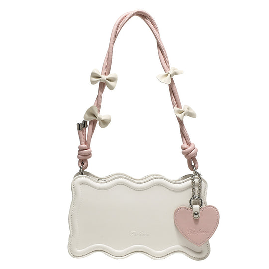 Damen Mini-Handtasche mit kreativem Wellenmuster und verspieltem Anhänger Nord Taschen
