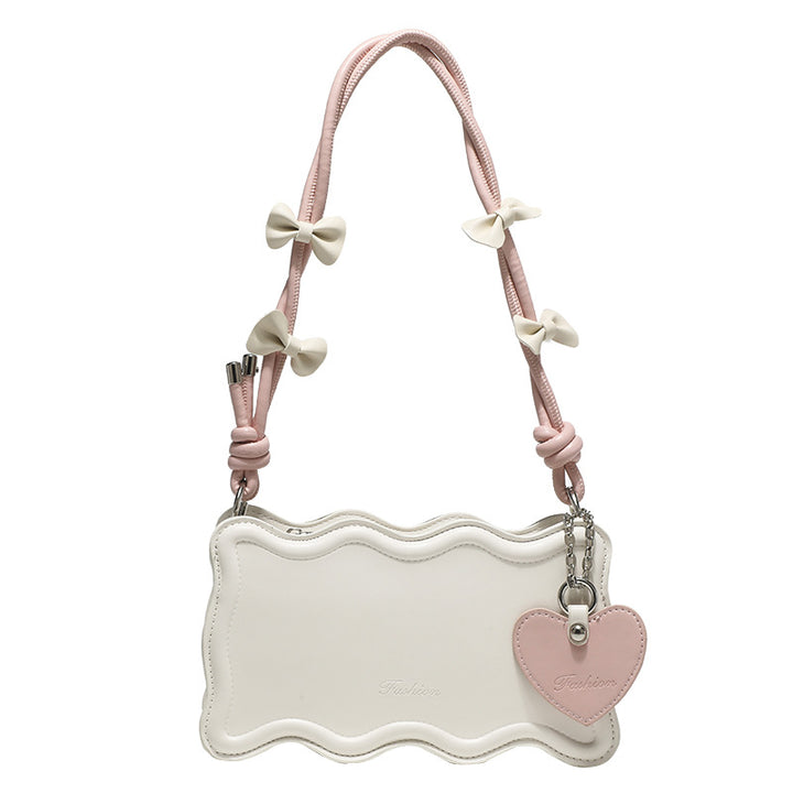 Damen Mini-Handtasche mit kreativem Wellenmuster und verspieltem Anhänger Nord Taschen
